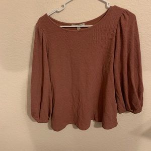 Pink puffy sleeve shirt.